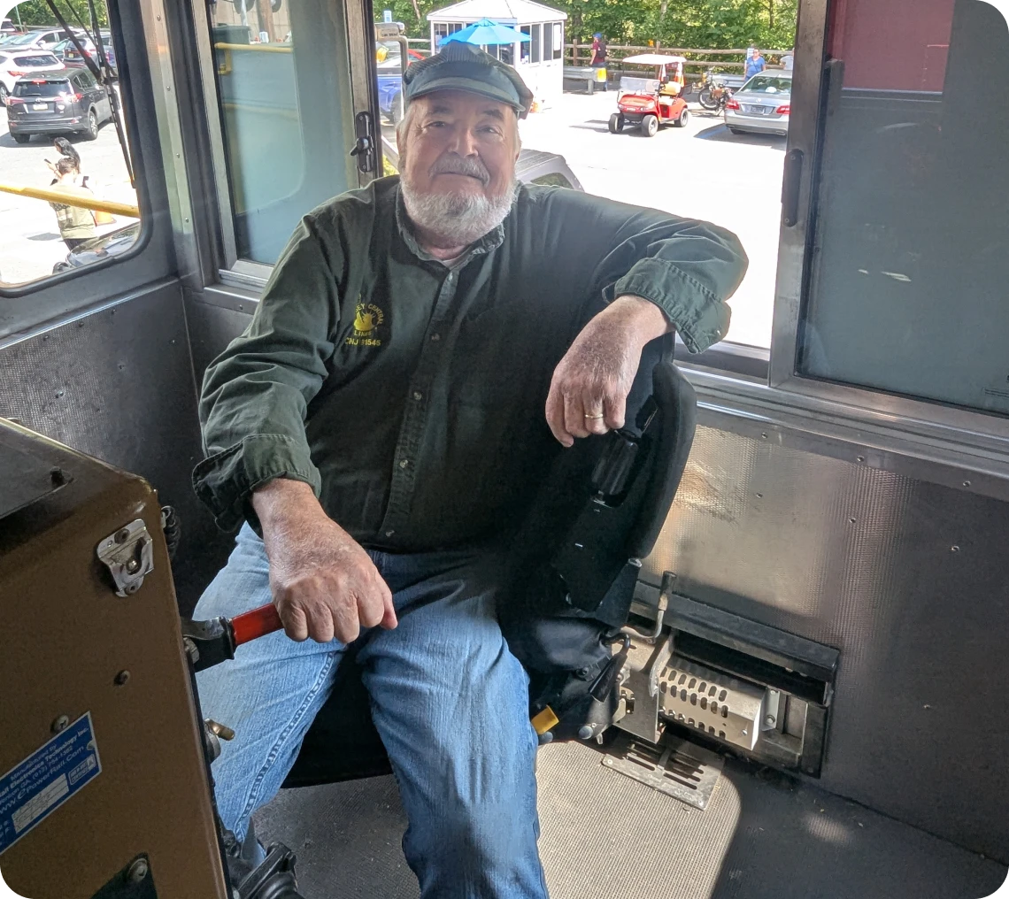 Bus driver sitting in driver's seat