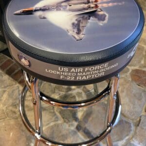 Stool seat featuring F-22 jet artwork