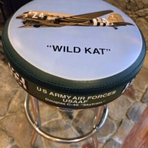 Round stool with "WILD KAT" airplane design