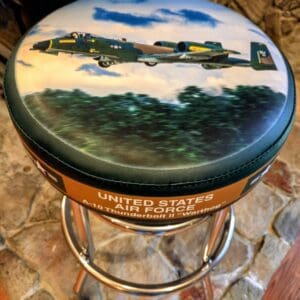 Barstool top with A-10 aircraft artwork