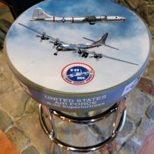 Stool seat featuring B-29 Superfortress airplane artwork